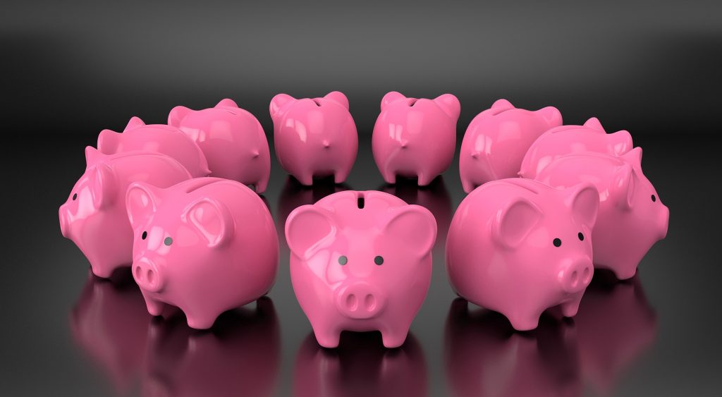 Several piggy banks arranged in a circle.