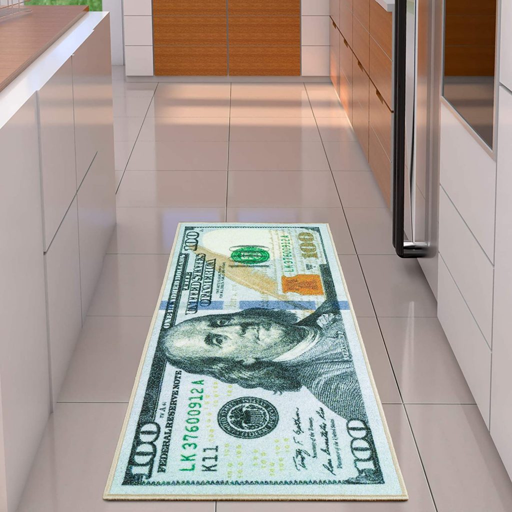 A runner rug with an enlarged $100 bill printed on it.